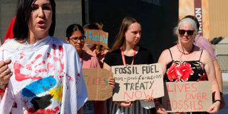 Activists against fossil fuel stage a protest during the COP27