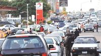 Motorists block a road in Abuja, Nigeria