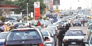 Motorists block a road in Abuja, Nigeria