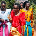 Women dressed in colourful gomesi
