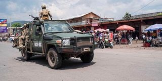 EACRF soldiers drive in Goma