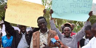 People protesting against alleged grabbing