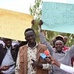 People protesting against alleged grabbing