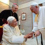 Pope Francis greets Pope Emeritus Benedict XVI