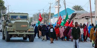 Demonstrators attend a rally against Al-Shabaab