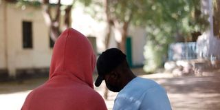 Two men speak during an interview