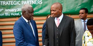 Moussa Faki Mahamat and Cabinet Secretary Moses Kuria