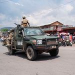 East African Community force soldiers drive in Goma