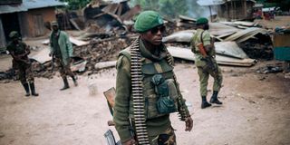 Armed DRC soldier patrol in Manzalaho near Beni