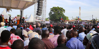 People listen to Tanzanian opposition leader Tundu Lissu 