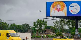 A billboard with the image of Pope Francis in Kinshasa