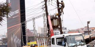 Umeme technicians at work in Kampala, Uganda.