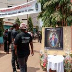Mourners gather in the courtyard of Radio Amplitude FM
