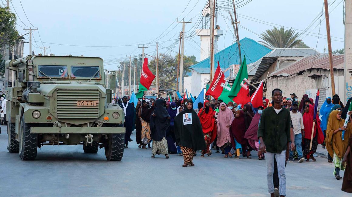 Demonstrators attend a rally against the Al-Shabaab