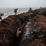 Ukrainian servicemen make a trench near Bakhmut