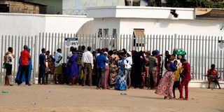 People gather at a bank in Ibafo, Ogun State in Nigeria 