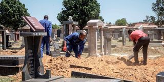 Workers at a cemetery in South Africa. 