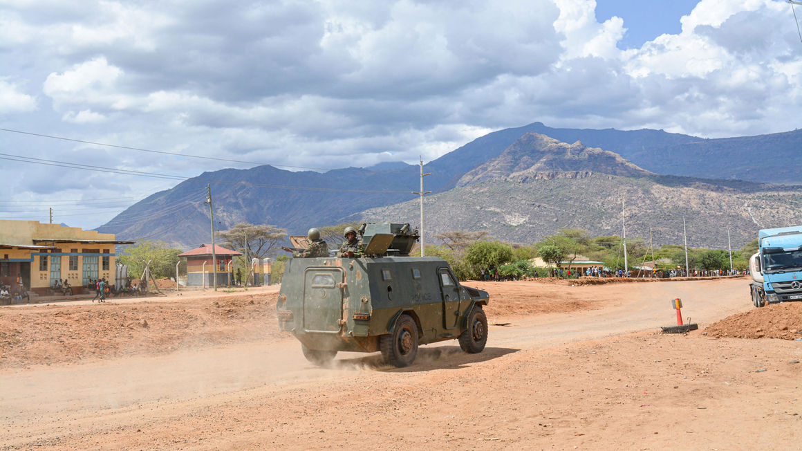 An armoured personnel carrier patrolling Kainuk town