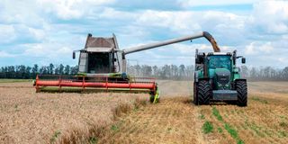 Farmers harvest wheat in Ukraine's Kharkiv region