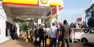 Kenyans queue to buy fuel on April 7, 2022.