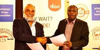 Yego CEO Karan Vir Singh and Digital Taxis Association Chairman David Muteru 