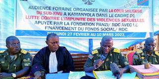 Congolese magistrates attend the military court
