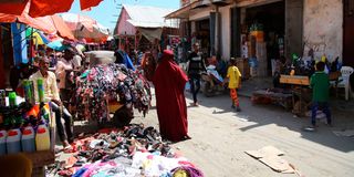 Traders sell their wares along a street in Somalia