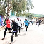 People run in Nairobi’s Kibera during demos