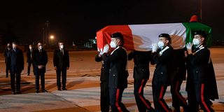 Police officers carrying the coffin of Luca Attanasio 