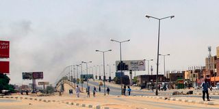 Smoke rises above buildings in Khartoum 