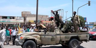 People greet Sudanese army soldiers 