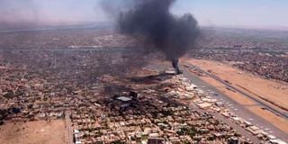 Black smoke rises above Khartoum International Airport 