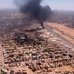 Black smoke rises above Khartoum International Airport 