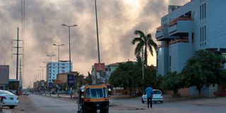 Smoke billows above residential buildings in Khartoum 