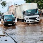 Vehicles drive through floods in Nairobi, Kenya