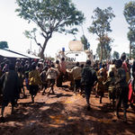 Congolese children run after a UN armoured personnel carrier 