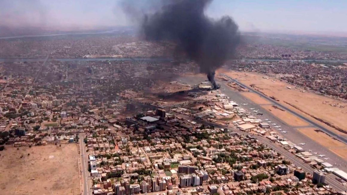 Black smoke rises above Khartoum International Airport 