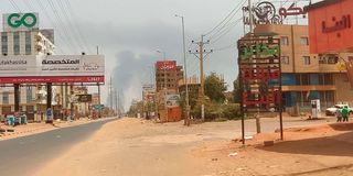 Smoke rises in the horizon in an area east of Khartoum