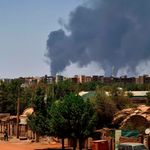 Smoke billows over buildings in Khartoum on May 1, 2023