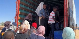 Sudanese families in a truck