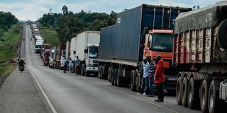 Trucks wait to enter Uganda at the Malaba border