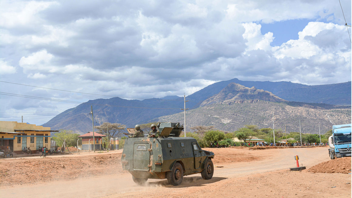 An armoured personnel carrier patrolling Kainuk town