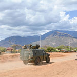 An armoured personnel carrier patrolling Kainuk town