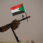 Sudanese national flag is attached to a machine gun of Paramilitary Rapid Support Forces (RSF) soldiers