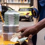 A currency trader in Kinshasa, DR Congo